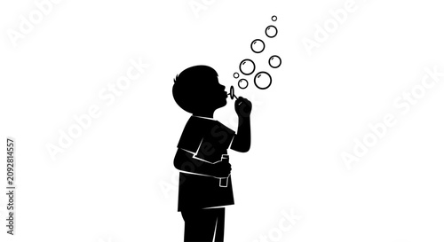 Black silhouette of a young child blowing soap bubbles isolated on white.