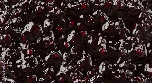 Close-up of dark berry jam with visible seeds and glossy texture