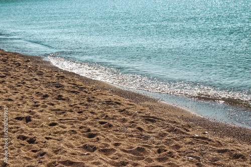 Photos The waves receding in the afternoon sun looks like liquid silver