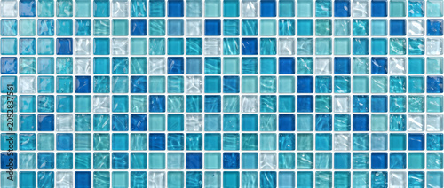Glass featuring a seamless collection of glossy blue square mosaic tiles with aquatic reflections for premium decorative surface backgrounds