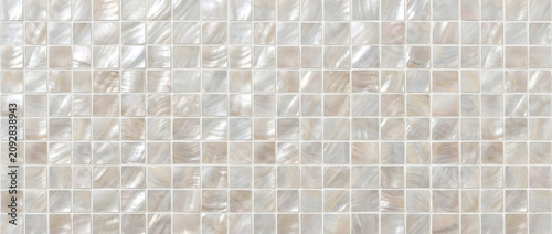Mother of pearl featuring a seamless square mosaic tile pattern with luminous natural shell texture for elegant luxury interior surfaces