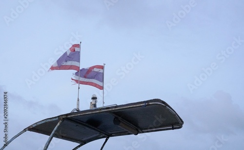 Foto Thai national flag against a sky backdrop