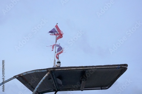 Quadro su tela Thai national flag against a sky backdrop
