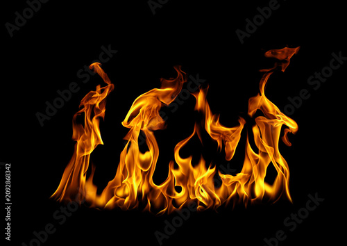 Foto Realistic fire flames isolated on black background with blazing orange fire, heat, burning energy, inferno, and flame texture