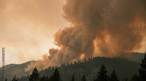 Forest Fire Disaster: A catastrophic forest fire rages on a mountainside, sending thick plumes of dark smoke billowing into the hazy, orange sky.