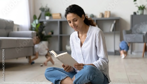 Woman sitting on floor with laptop.