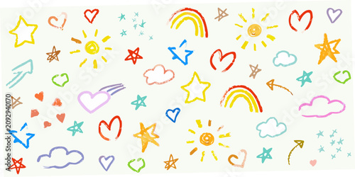 Foto Colorful crayon drawings of stars hearts rainbows and clouds on white