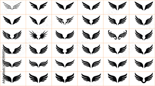 Canvastavla Collection of diverse black stylized wing silhouettes on a white background repr