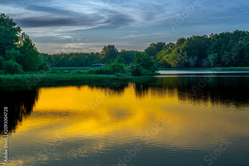 Fotografie Scenic sunset at James A Reed wild life area with warm golden light