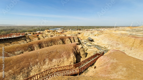 Tableau sur toile Unique colorful Yardang landform of the Five Color Beach along the Irtysh River under a blue sky, Xinjiang
