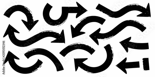 Photos Collection of hand drawn black arrows with varying curves and directions on a wh