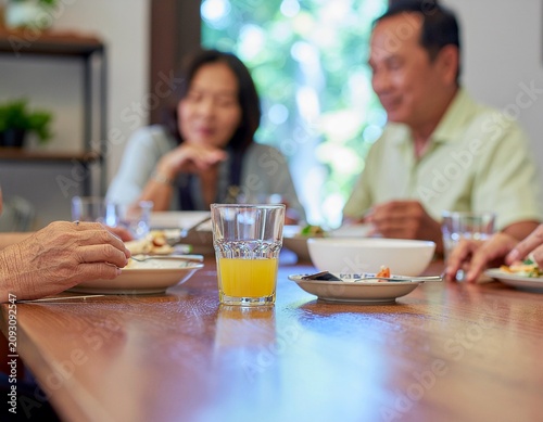 Multigenerational Family Sharing A Nutritious Breakfast At A Home Dining Table