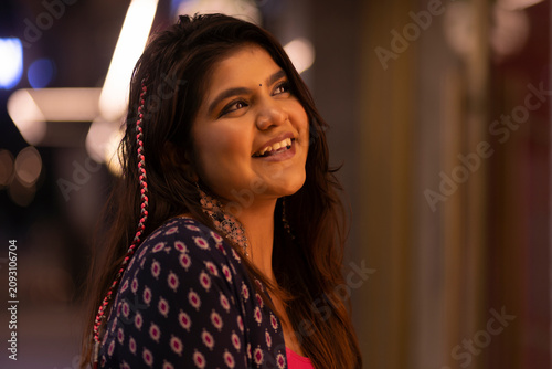 Portrait of happy woman looking elsewhere with smile