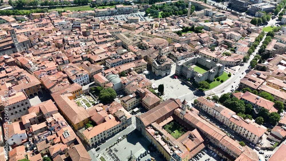 Fototapeta premium High altitude aerial shot of Prato urban area and horizon.