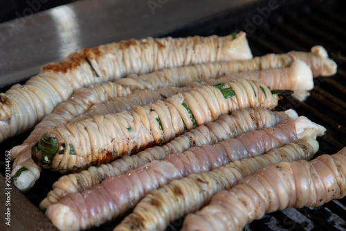 Fotografija Close-up of traditional Sicilian stigghiola in Ballaro Market in Palermo, a grilled street food delicacy made of lamb intestines wrapped around scallions