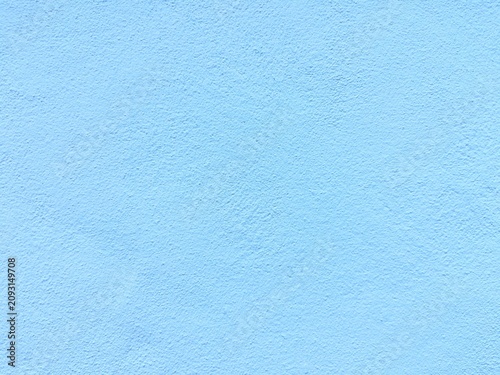 Light blue wall texture background, pastel blue concrete surface, solid color backdrop for design