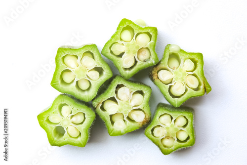 top view of fresh okra slices isolated on a white background