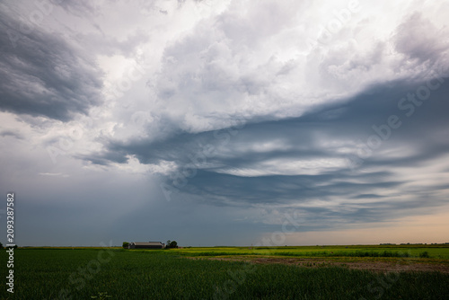 Bild auf Leinwand Ominous, moody sky as an approaching thunderstorm shapes layered, textured cloud