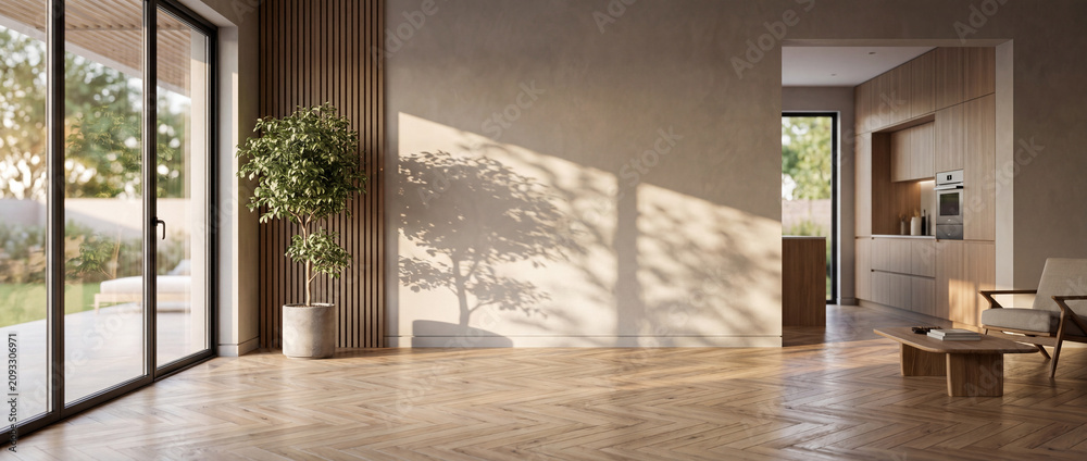Fototapeta premium Empty modern minimalist sunlit living room with natural wooden parquet flooring, a potted green plant casting soft shadows on a beige plaster wall, and a kitchen background for interior design