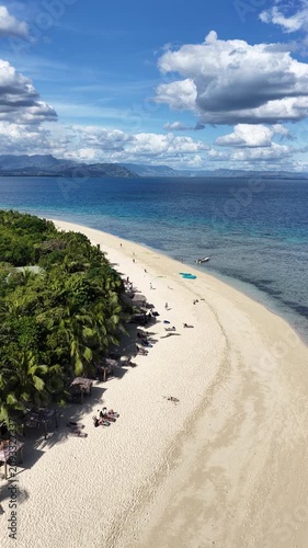 Vertical aerial view of beach loungers on a sandbar, Serenity Island, Fiji