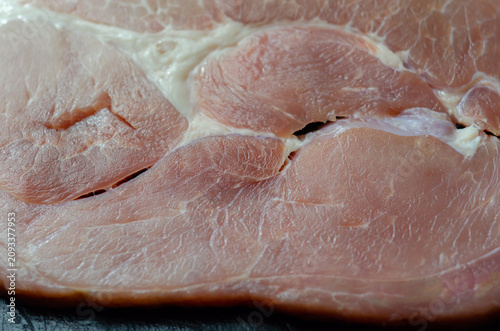 Raw pork loin with visible fat marbling and tender texture
