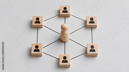 Strategy team roles project management teamwork and strategy are visually represented by wooden blocks connected in network symbolizing collaboration and effective team roles in project management