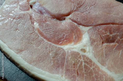Raw pork loin with visible fat marbling and tender texture