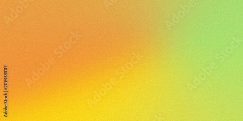 Orange yellow and green grainy gradient background with soft luminous abstract color blend