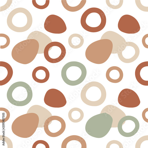 Seamless abstract pebble pattern with organic shapes in earth tones.