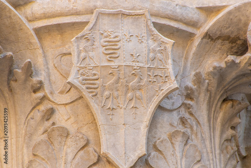 Принти на полотні Detail of an antique column with the Symbols of Milan