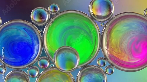 Abstract macro photography of colorful oil droplets floating on water surface