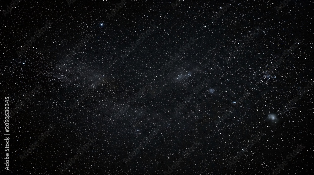 Fototapeta premium Cosmic galaxy cluster in deep space. Milky Way-inspired starfield with vibrant nebulae and celestial bodies. Astronomy background for science, educ...
