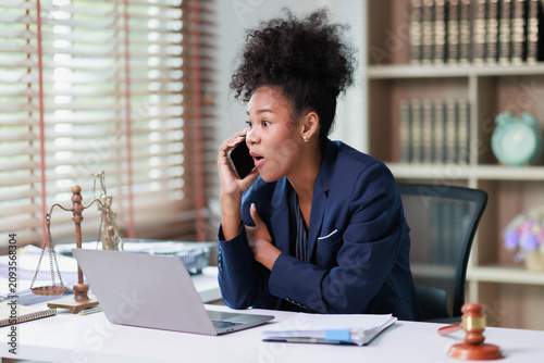 Принти на полотні Professional african american lawyer woman responding with surprise during an im