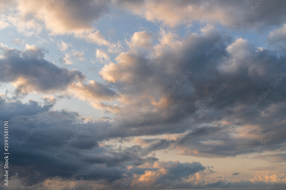 Fototapeta premium Sunset after rain with thunder clouds. Sky background.