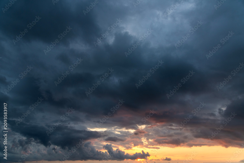 Fototapeta premium Sunset after rain with thunder clouds. Sky background.