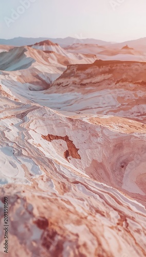 Stunning aerial view of colorful painted desert hills and geological rock formations.