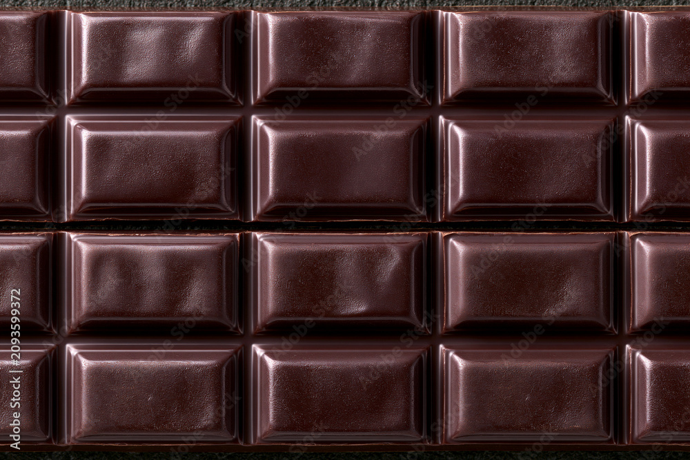 Naklejka premium Seamless dark chocolate bar squares texture background
