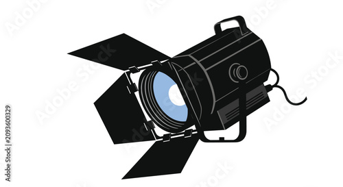 Large black professional stage or studio spotlight with barn doors adjusted to focus light for theater productions or film sets.