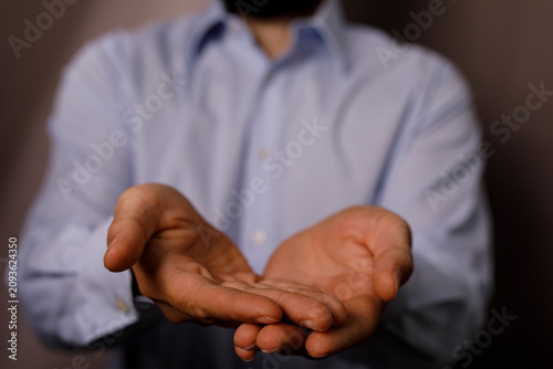 Fotografie Close up shot of a person's open hands, suggesting giving or receiving help, kindness