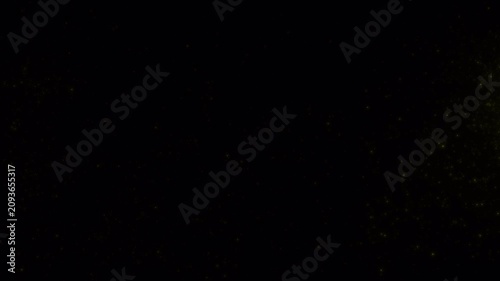 Dark abstract background with slow shifting yellow light flares.