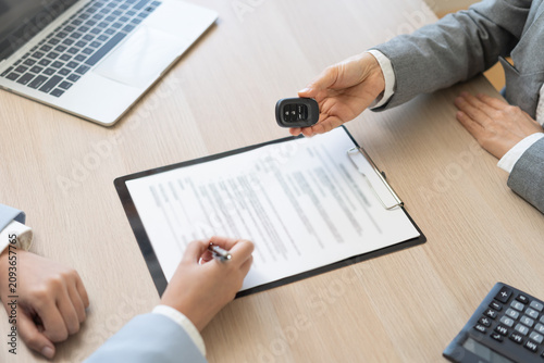 Business transport car, sell service, hand of agent dealer, sale giving auto key vehicle to customer after sign on lease paperwork, document contract with buyer young woman client transfer automobile.