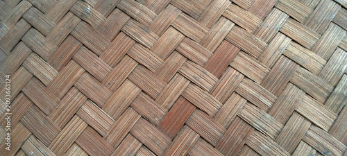 A close-up view of the intricate texture of traditional bamboo weaving.