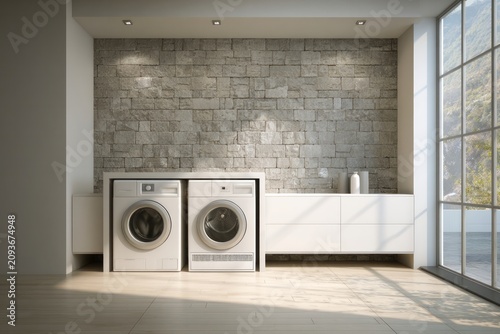 Modern utility room features stacked white appliances set against a textured stone accent wall beside a large window