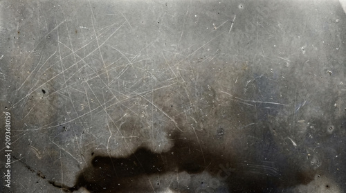 Fotografie Grungy scratched metal texture background, distressed silver steel surface, indu