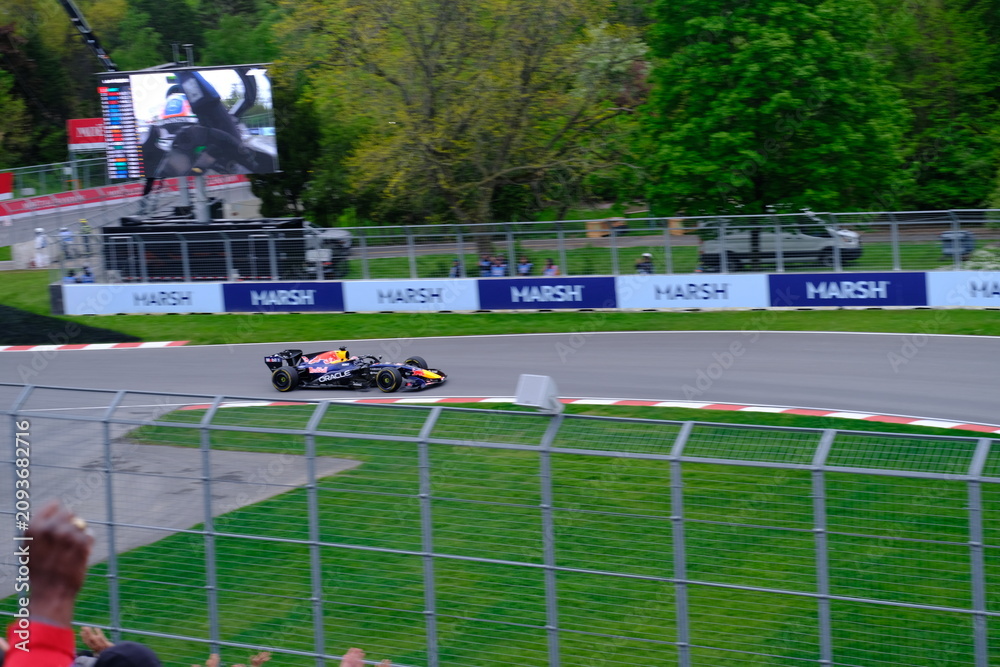 Obraz premium May 24, 2025, Montreal, Canada: Red Bull Racing Formula 1 car during by Hadjar or Verstappen, demonstration run at Circuit Gilles Villeneuve. g.