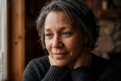 Mature woman smiling, expressing authentic emotions and personality