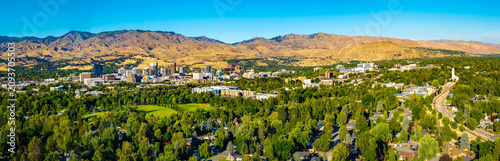 Boise downtown skyscrapers glow under panoramic sunset