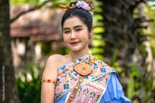 Fotografie Elegant portrait of beautiful Thai woman wearing Thai traditional national dress