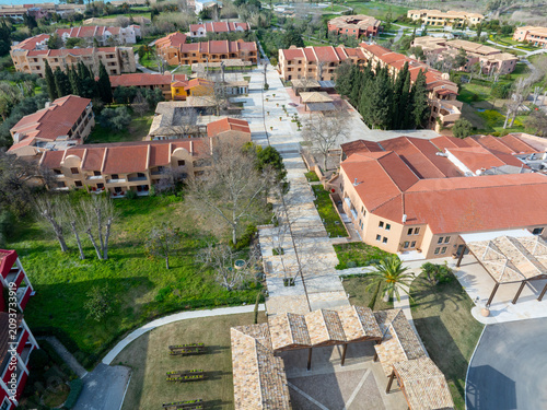 Aerial View of Traditional Mediterranean Resort Village Architecture and Walkways in Corfu Greece