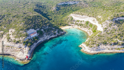 Фотография Aerial view of a secluded turquoise bay near Bonifacio, Corsica, France, surroun